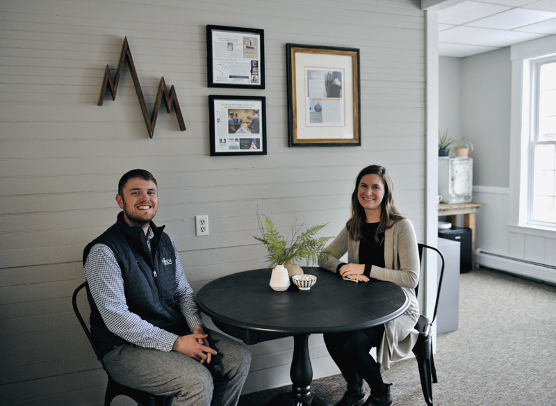 Two people sitting in CAP offices in Bristol