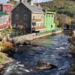 Bristol NH mill building apartments downtown along a river