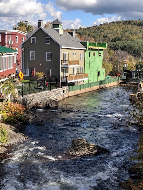 Bristol NH mill building apartments downtown along a river