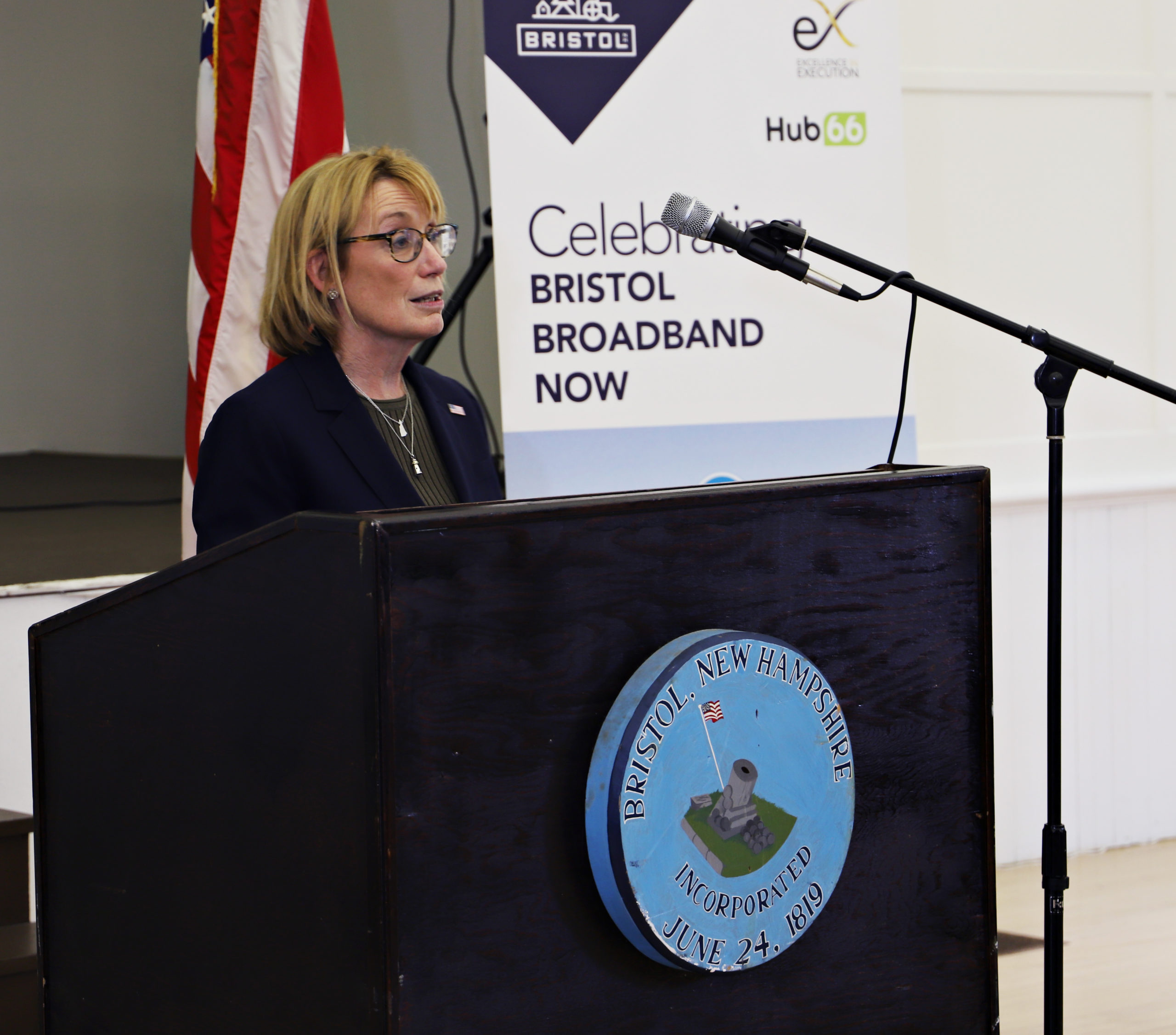 Sen Maggie Hassan at a podium speaking at the Bristol Broadband Now ribbon cutting